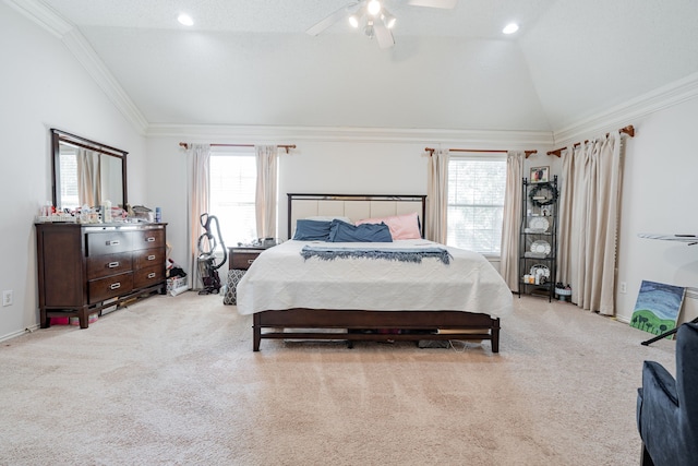 bedroom with light carpet, vaulted ceiling, crown molding, and ceiling fan