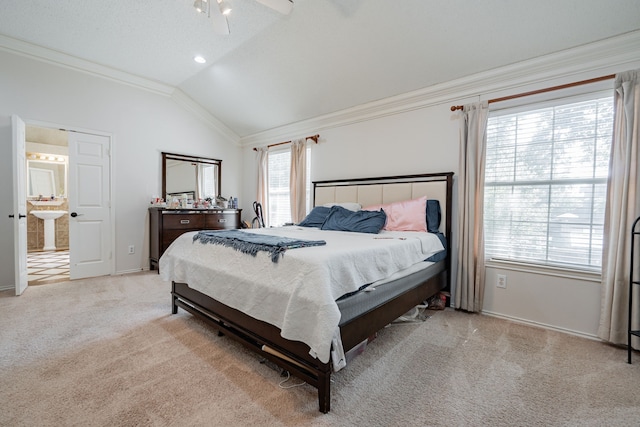 carpeted bedroom with ceiling fan, ornamental molding, and lofted ceiling