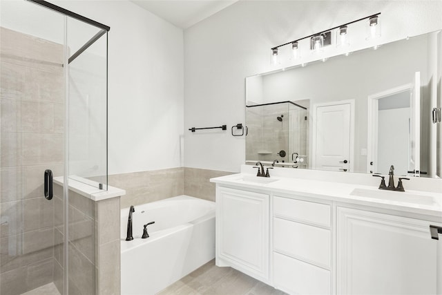 bathroom featuring separate shower and tub, wood-type flooring, and vanity