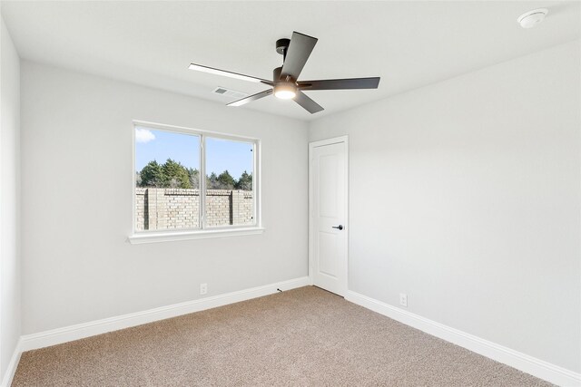 carpeted empty room with ceiling fan