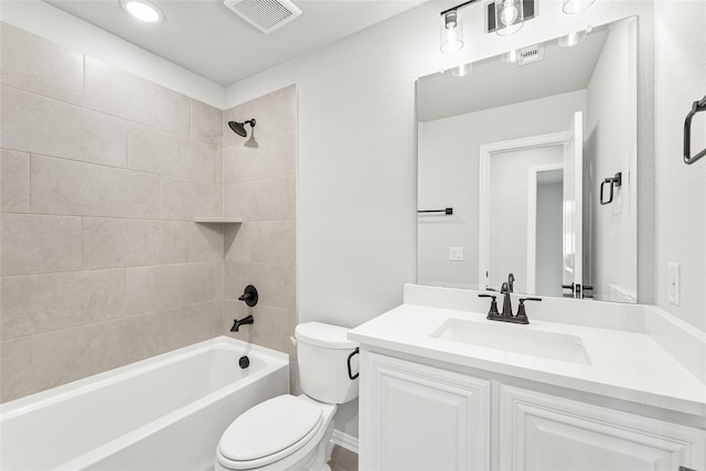 full bathroom with toilet, tiled shower / bath combo, and vanity