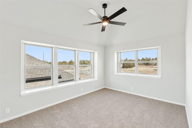 carpeted spare room with ceiling fan and a healthy amount of sunlight