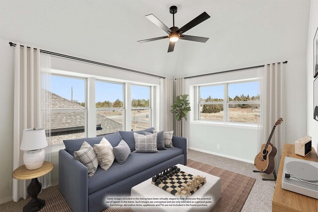 living room with ceiling fan and carpet