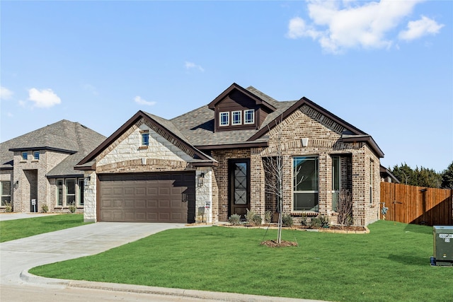 view of front facade featuring a front lawn and a garage