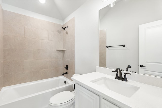 full bathroom featuring toilet, vanity, and tiled shower / bath combo