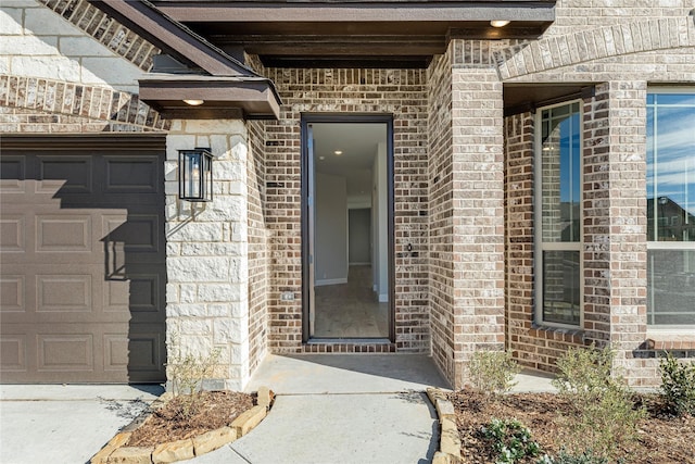 doorway to property featuring a garage