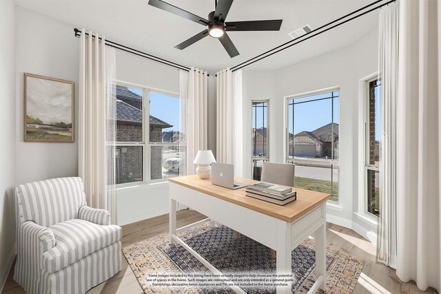 office space with ceiling fan and light hardwood / wood-style floors