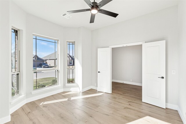 interior space featuring ceiling fan and light hardwood / wood-style flooring