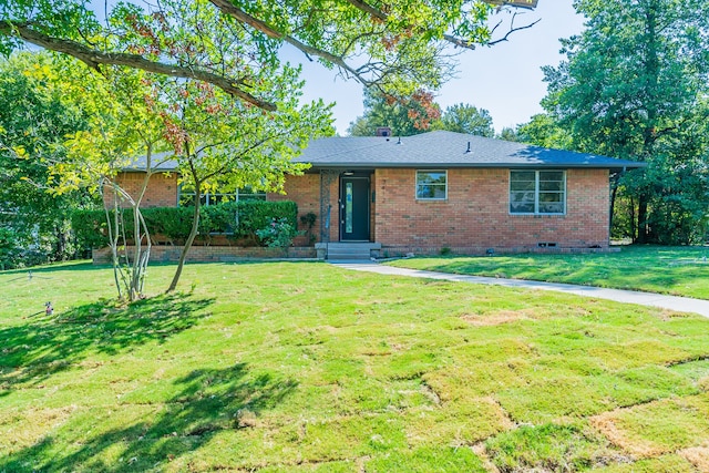 ranch-style home with a front lawn