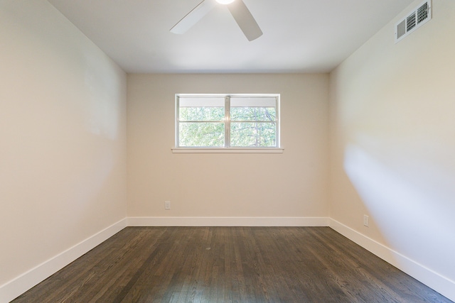 unfurnished room with ceiling fan and dark hardwood / wood-style flooring