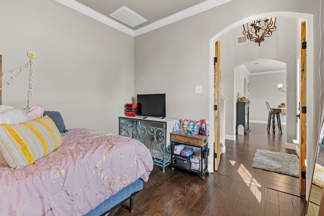 bedroom with ornamental molding, a notable chandelier, and dark hardwood / wood-style flooring