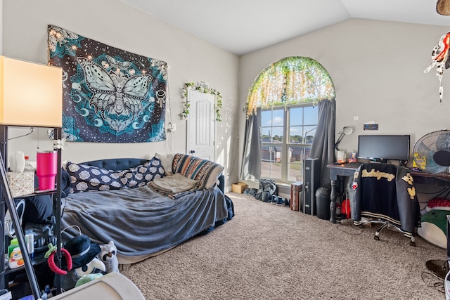 bedroom featuring carpet floors and vaulted ceiling