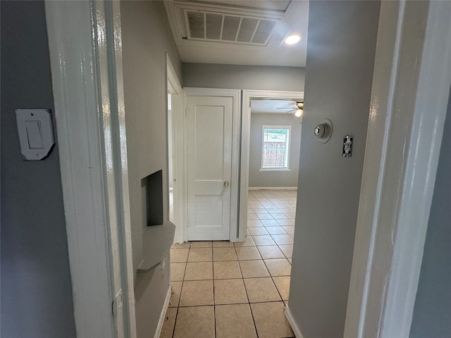 hallway featuring light tile patterned floors