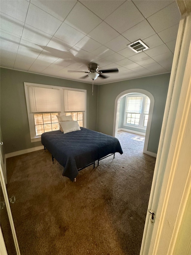 carpeted bedroom with ceiling fan