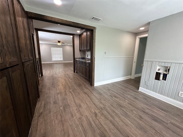 interior space featuring wood-type flooring, a textured ceiling, and sink