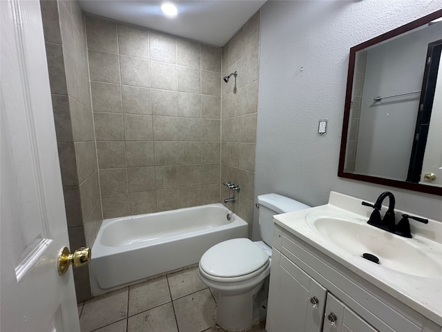 full bathroom featuring toilet, tile patterned flooring, vanity, and tiled shower / bath