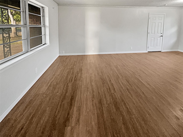 spare room with wood-type flooring and a textured ceiling