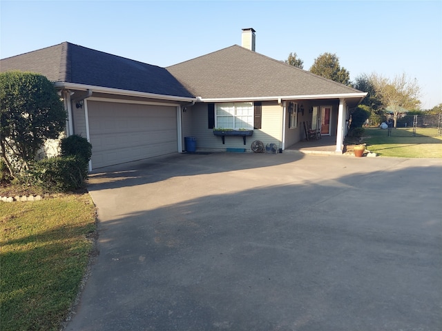 ranch-style house with a front yard and a garage