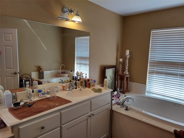 bathroom featuring vanity and a tub to relax in