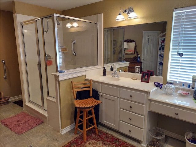 bathroom with vanity, tile patterned flooring, and walk in shower