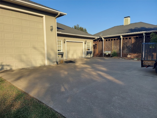 view of side of home featuring a garage