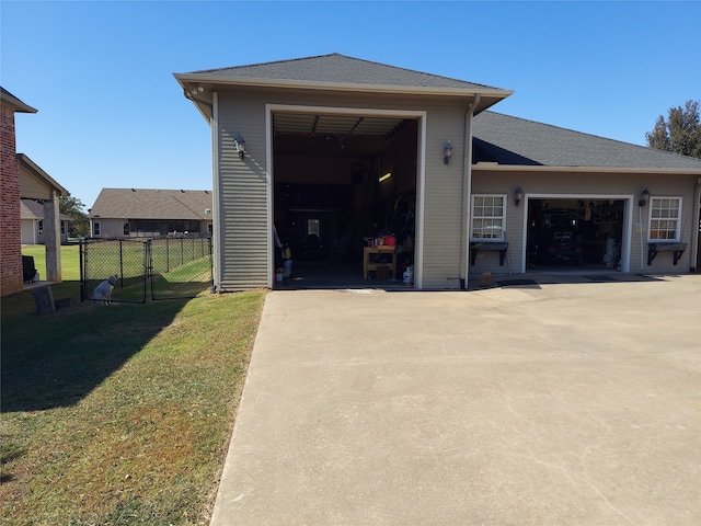 exterior space featuring a yard and a garage