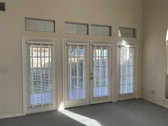 doorway with carpet flooring