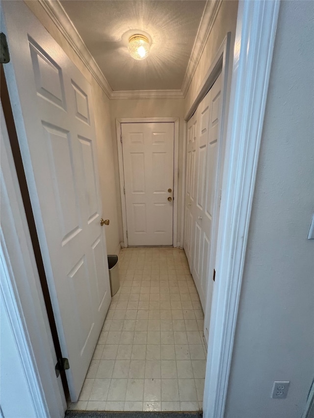 hallway featuring crown molding