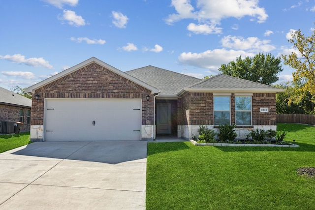 ranch-style home featuring a front yard, a garage, and central air condition unit