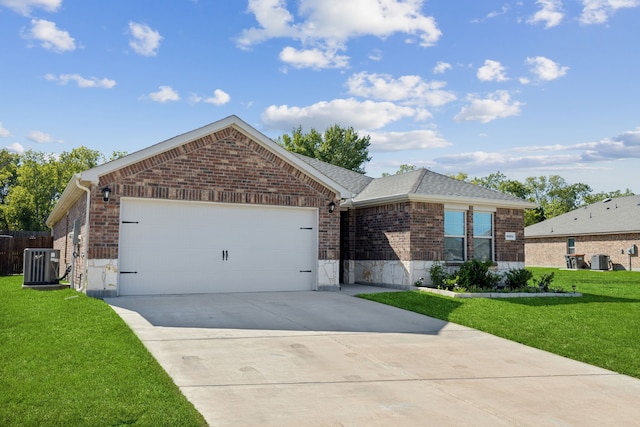 ranch-style home featuring a front lawn, cooling unit, and a garage