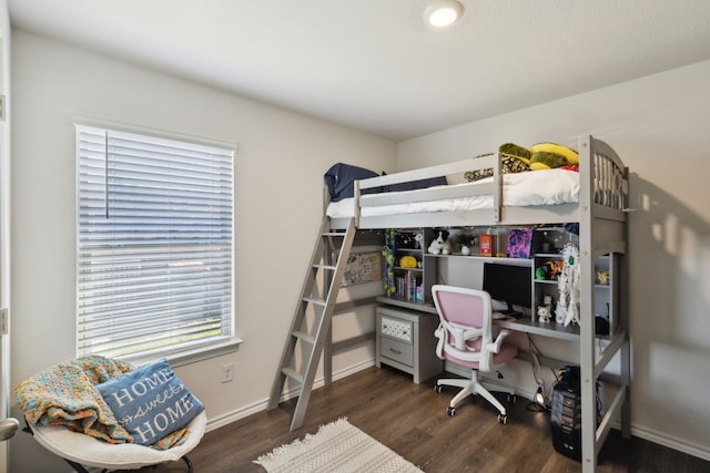 bedroom featuring dark hardwood / wood-style flooring