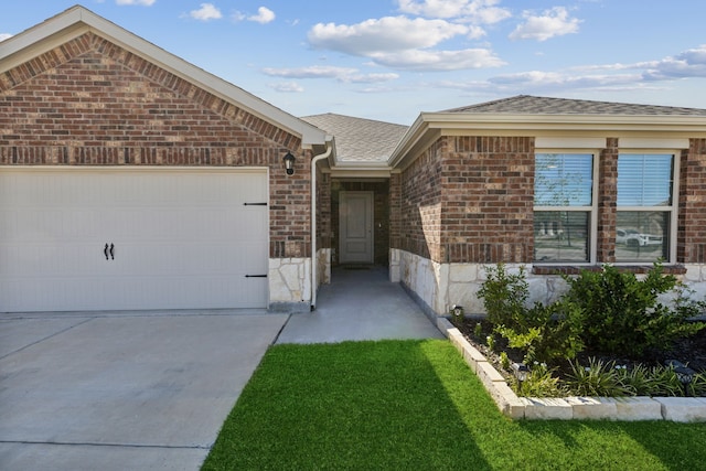 ranch-style home featuring a garage