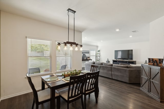 dining space with dark wood-type flooring