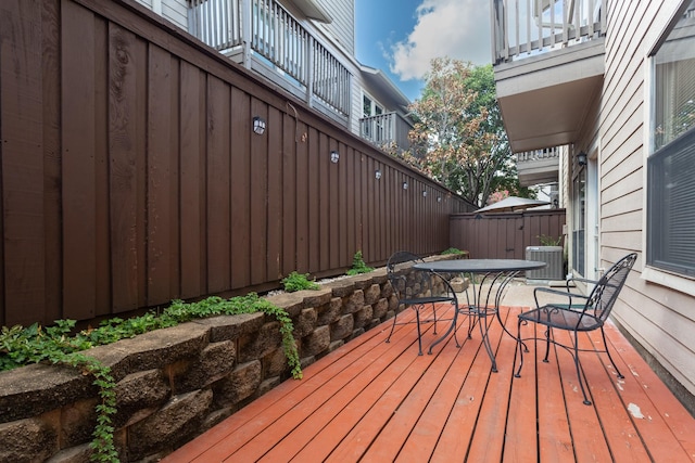 5616 Preston Oaks Rd Unit 1403, Dallas, TX 75254 - deck featuring outdoor dining space and central AC unit