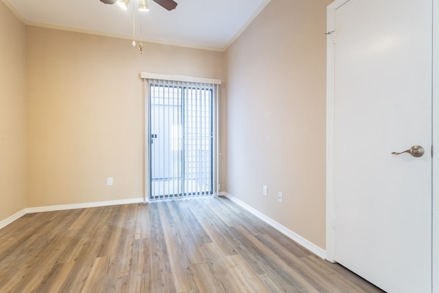 empty room featuring ornamental molding, light hardwood / wood-style flooring, and ceiling fan