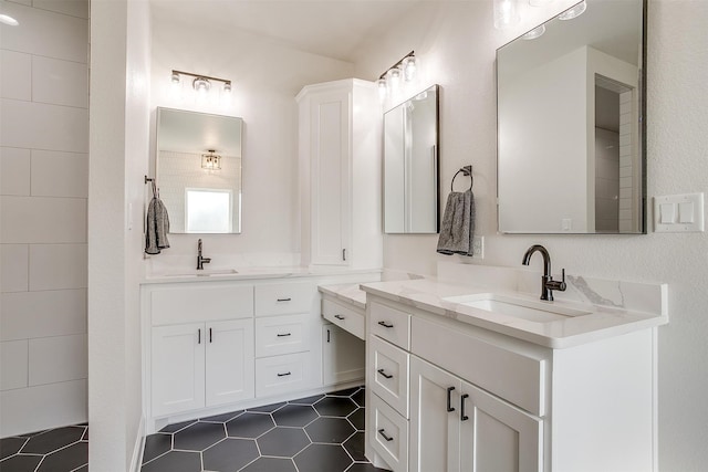 bathroom with tile patterned flooring and vanity