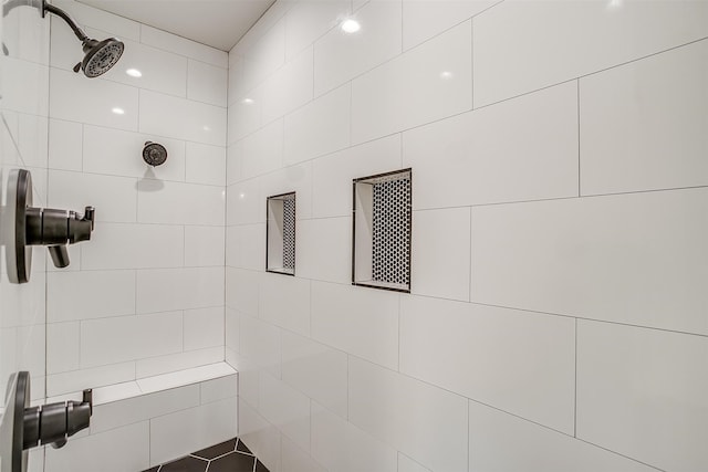 bathroom with tiled shower