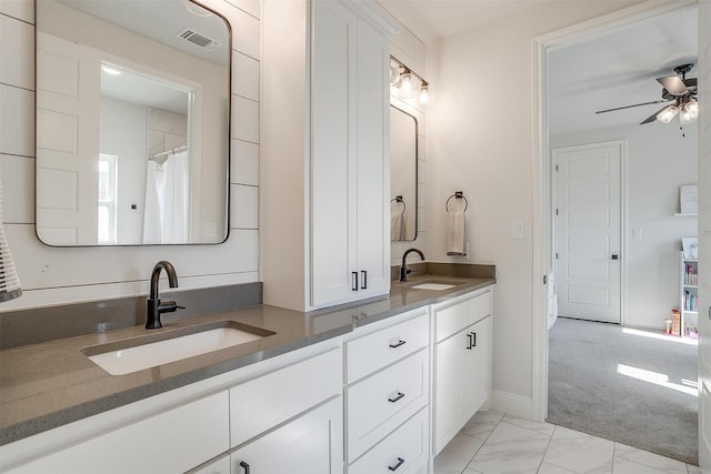 bathroom with ceiling fan and vanity