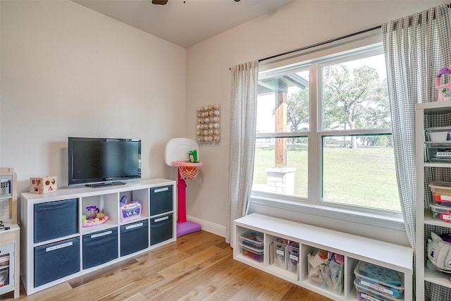 playroom featuring ceiling fan and light wood-type flooring