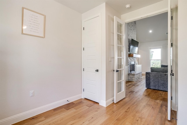 hall with light hardwood / wood-style floors