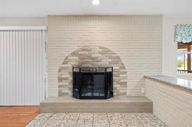 details with a fireplace and hardwood / wood-style floors