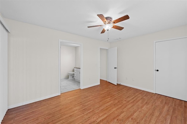 unfurnished bedroom with connected bathroom, ceiling fan, and light hardwood / wood-style flooring