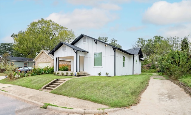 modern inspired farmhouse with a front yard