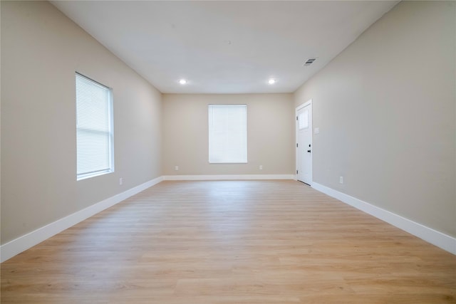 spare room featuring light hardwood / wood-style flooring