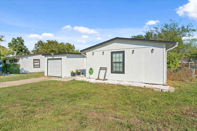 exterior space with a garage and a front yard