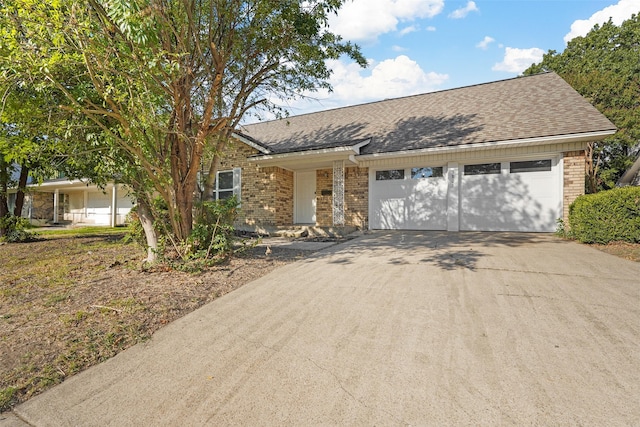 ranch-style house with covered porch and a garage