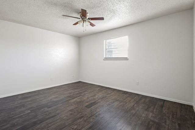 spare room with ceiling fan, dark hardwood / wood-style floors, and a textured ceiling