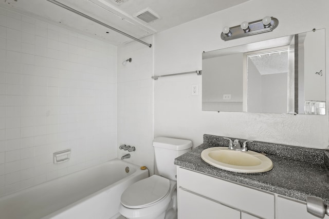 full bathroom featuring vanity, toilet, and tiled shower / bath