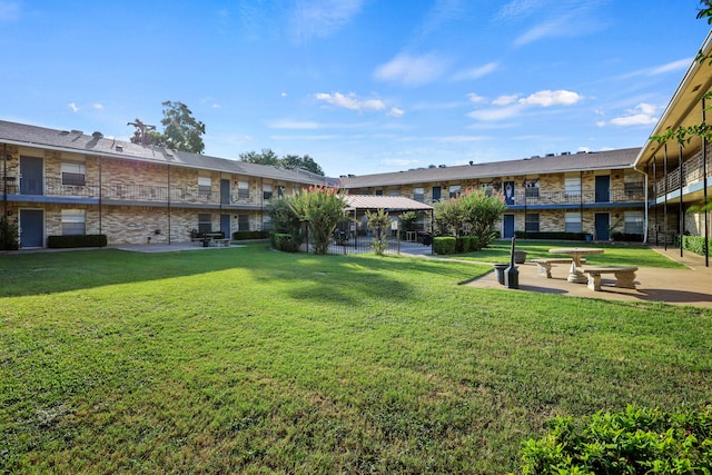 view of home's community with a lawn