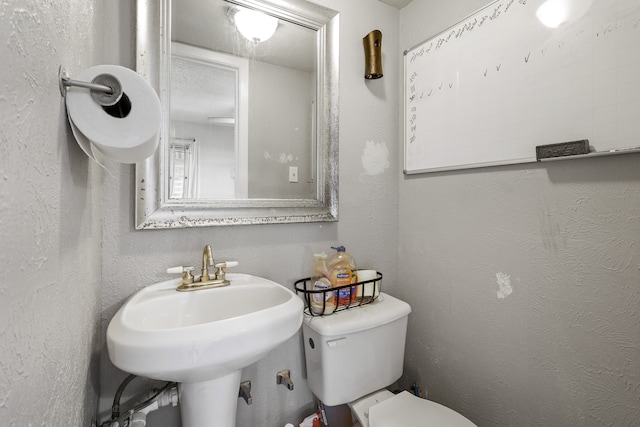 bathroom with sink and toilet